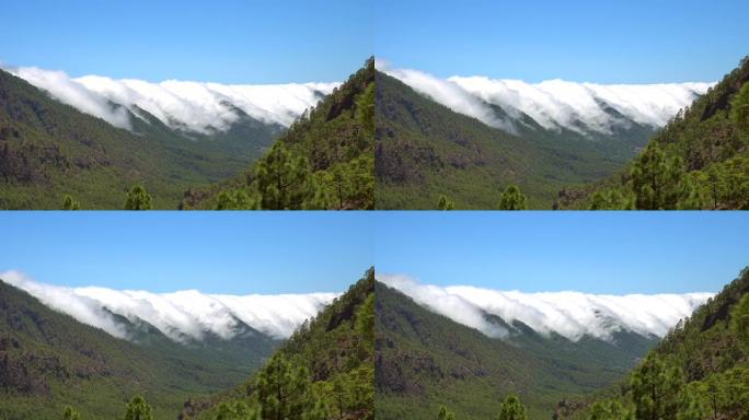 加那利群岛塔布里恩特破火山口旁边的拉帕尔玛岛上的拉坎布雷西塔山上的云层的延时。西班牙