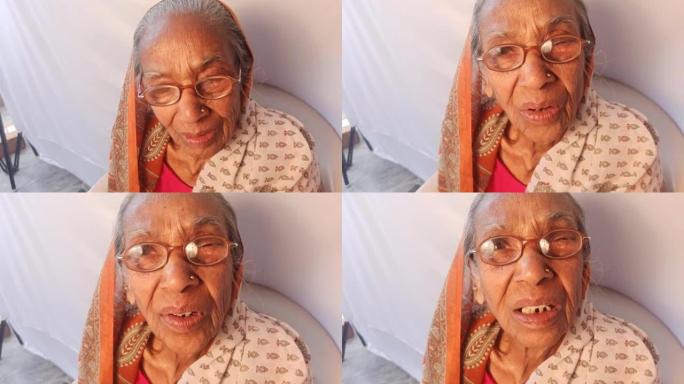 印度老妇人与家人和朋友交谈，