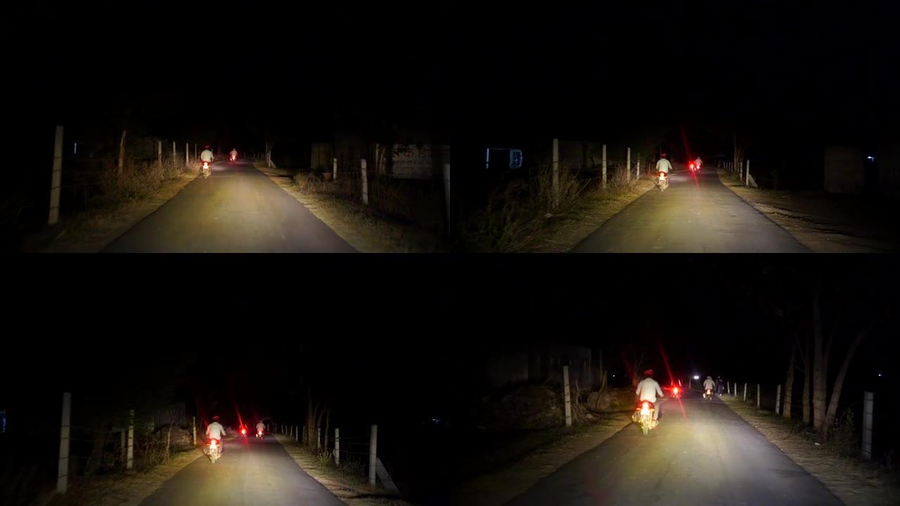 车辆通过带肉头灯的道路。沥青路面上的头光束。