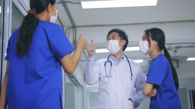 医生们击掌庆祝医生护士击掌特写视频素材