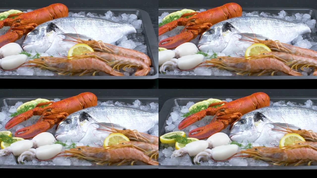 新鲜的鲷鱼，龙虾，虾和墨鱼在冰上配柠檬片