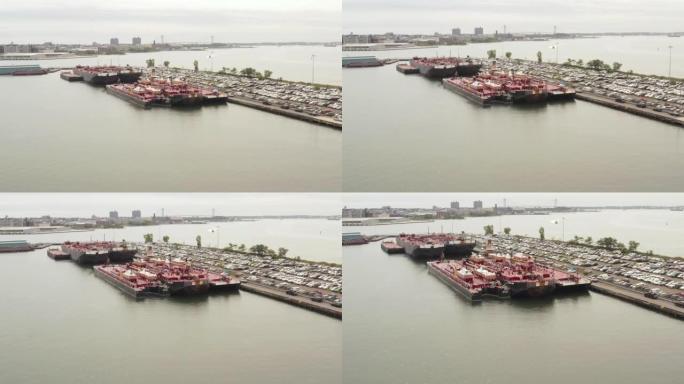 空中多莉 (dolly) 在港口的一辆完整的停车场中关闭了两艘锚定的运输船