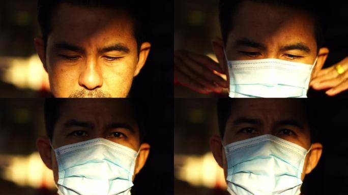一名男子戴着口罩，以防止PM 2.5灰尘和防病毒新型冠状病毒肺炎。