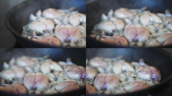 平底锅上油炸蛙腿的传统烹饪。