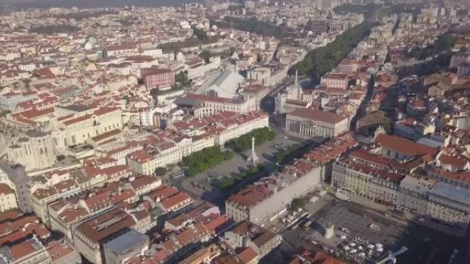 阳光灿烂的一天里斯本城市景观中央罗西奥广场空中全景4k葡萄牙