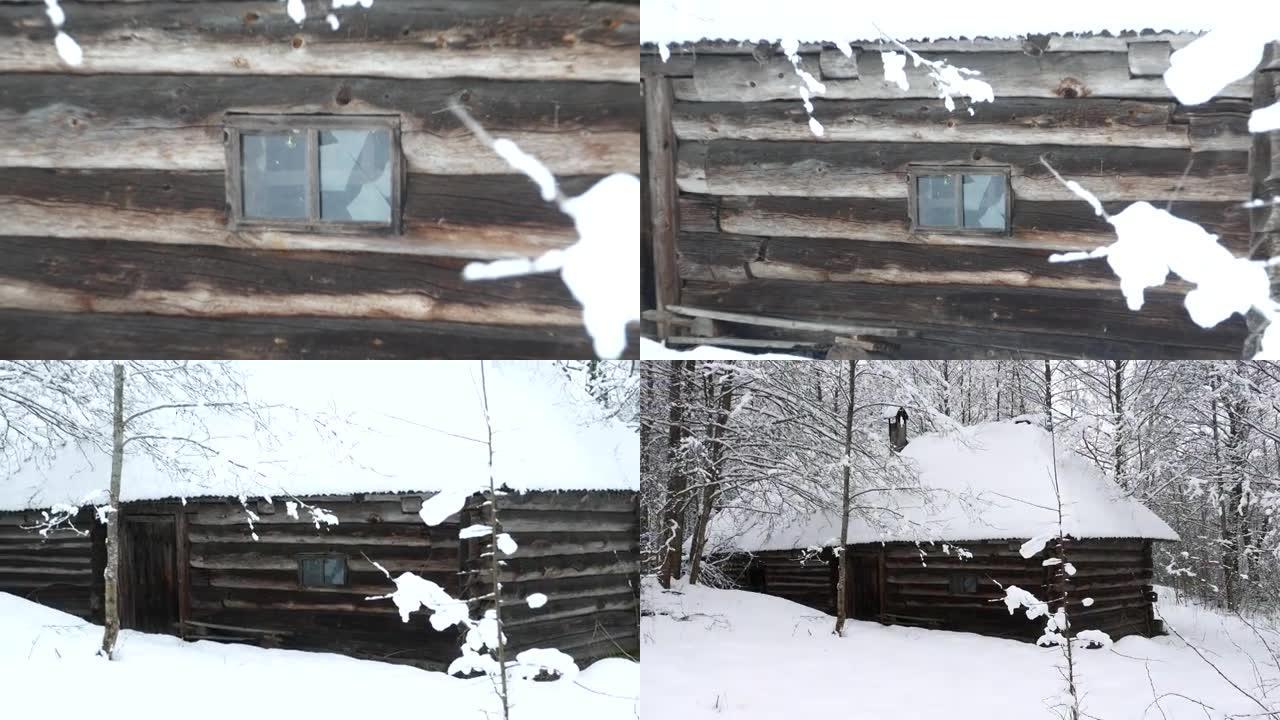 小屋在白雪皑皑的森林里。缩小。