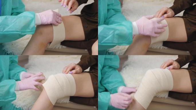 医生双手戴着医用手套的特写镜头，用绷带包扎一名女性患者受伤的腿。