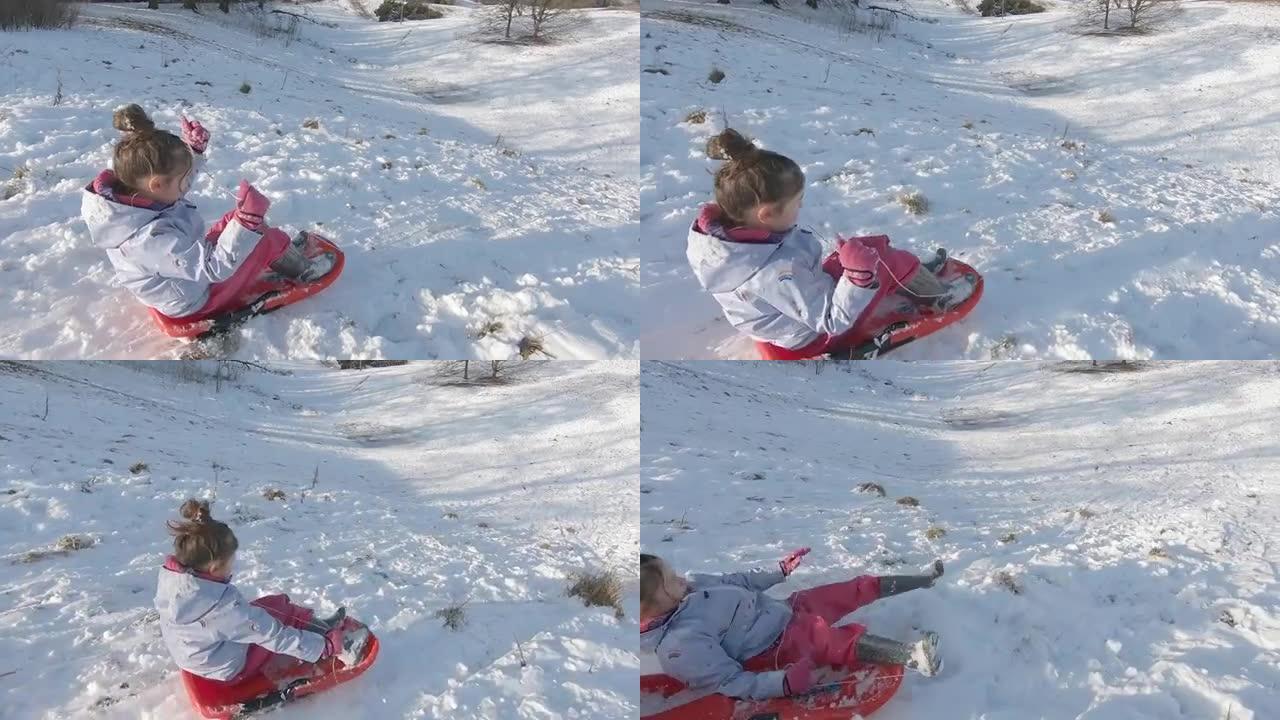 一个年轻的女孩在阳光下在雪山上玩过冬