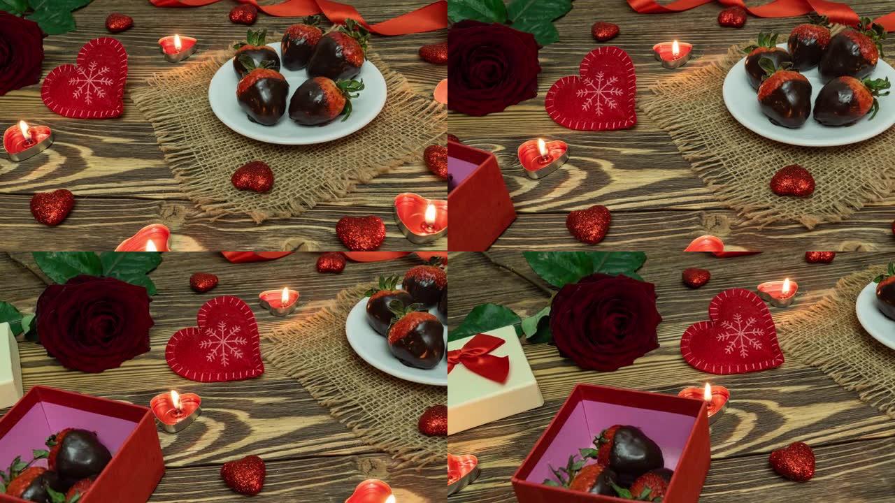 圣情人节。盒子上有巧克力覆盖的草莓，心形，蜡烛，红玫瑰。从上方观看。情人节。庆祝。4K