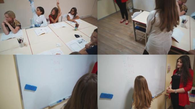 女教师在黑板上写正确答案时看着女学生