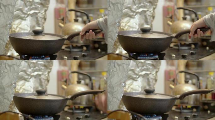 手摇烹饪锅，用于在厨房制作爆米花，周末生活方式概念。