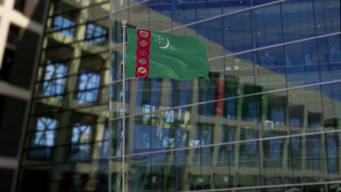 土库曼斯坦国旗飘扬在摩天大楼上