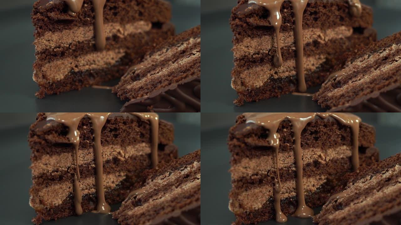 巧克力奶油在新鲜出炉的巧克力蛋糕上流动，并带有坚果馅。食物甜点背景特写。面包店和糕点店