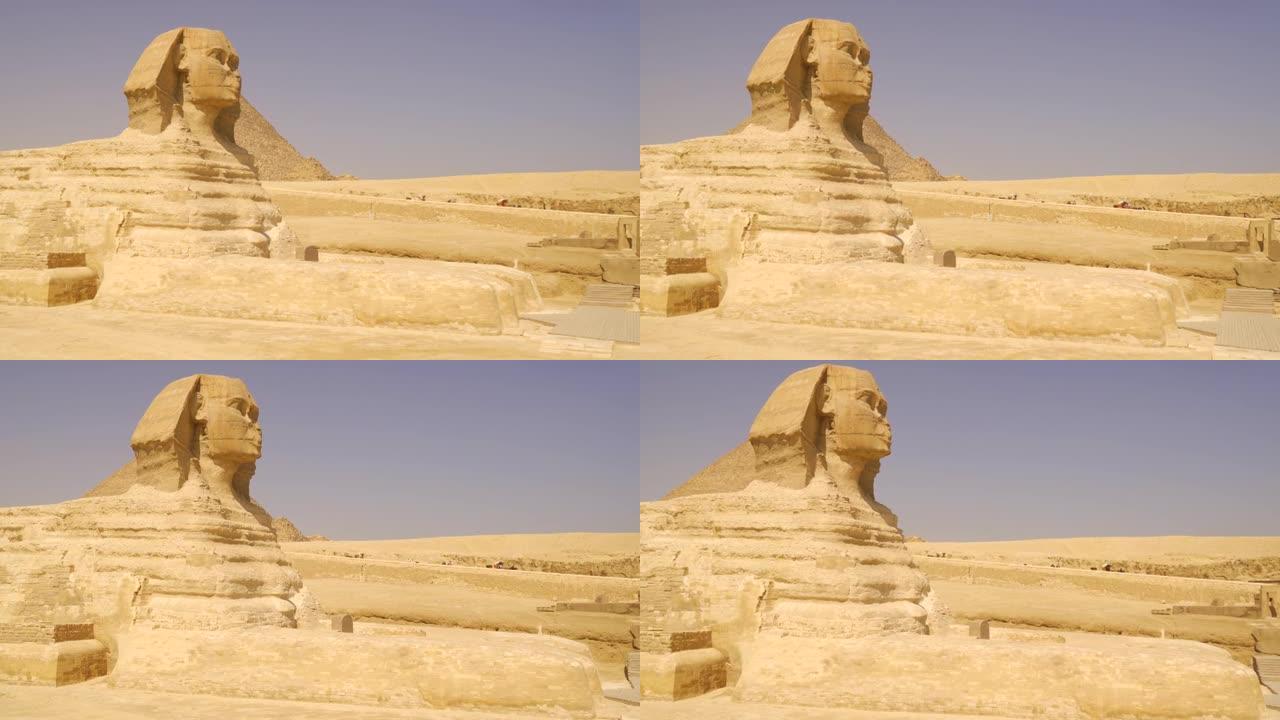 银座金字塔旁边美丽的吉萨狮身人面像的照片。埃及开罗