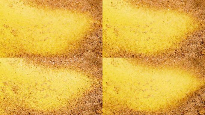 声波传播的可视化。黄色表面上的沙子。超级宏