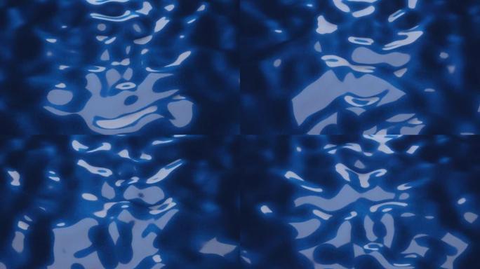 带有反射的蓝色液体表面波浪形运动。简单的运动图形循环动画