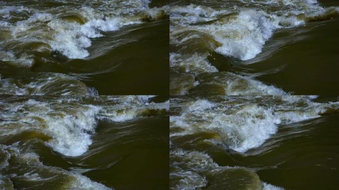 汹涌的河水，眩晕的水流，大雨后旋转的泡沫水波，奥地利穆尔河的混浊急流
