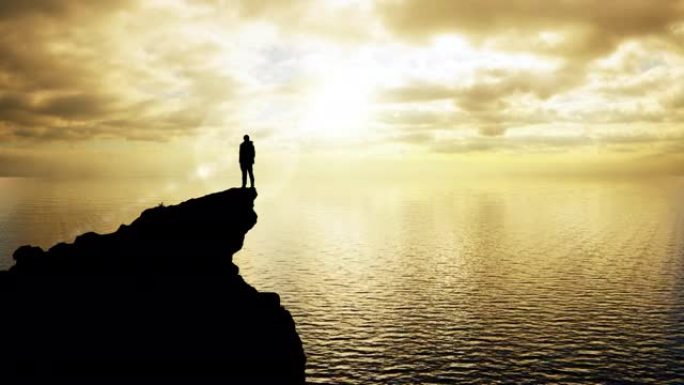 一个站在悬崖边缘的男人的剪影吸收了太阳的治愈能量，同时目睹了大自然的壮丽景色