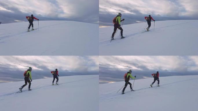 滑雪登山夫妇上坡滑冰雪运动冬天体育下雪冰