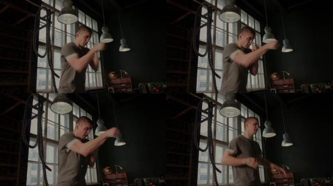 拳击绷带里的酷男战士在健身房训练。混合武术