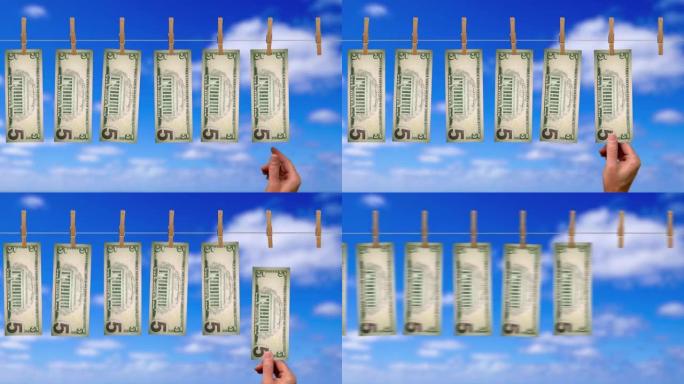 $5的洗钱线输送机，$5美元钞票的背面，背景为天空