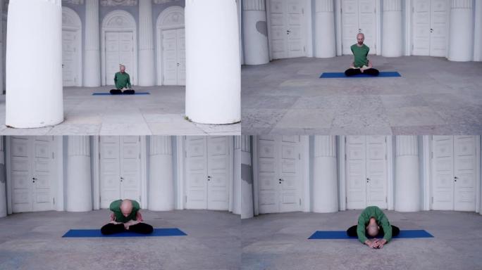 一个男人在室内做瑜伽，有很多门在做体式运动