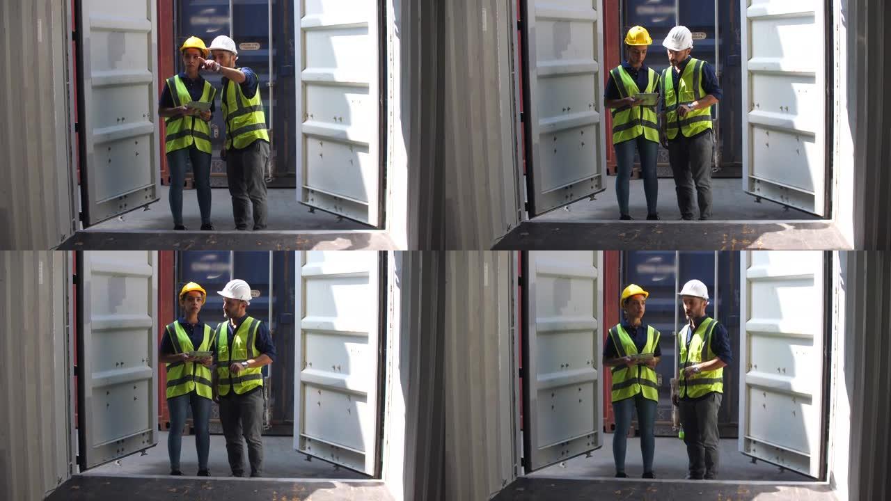 两名高加索集装箱码头员工打开并检查集装箱货物内部