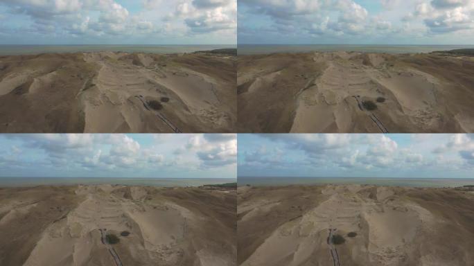 立陶宛库尔斯吐死沙丘沙漠的空中4k镜头-分隔波罗的海和库尔斯泻湖的天然沙漠