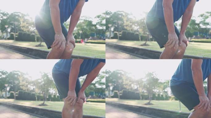 近距离射击老人在公园做膝盖弯曲热身，关节韧带骨问题，踝关节扭伤运动损伤预防