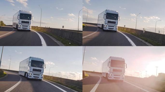 载货卡车，载货拖车在高速公路上行驶。白色卡车凌晨送货