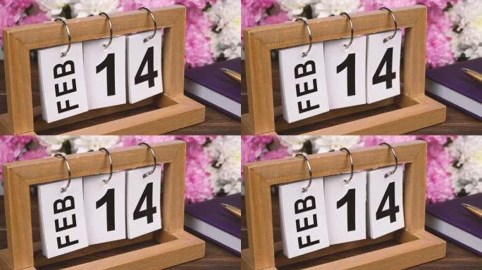 带有2月14日日期和一束美丽花朵的桌面日历。