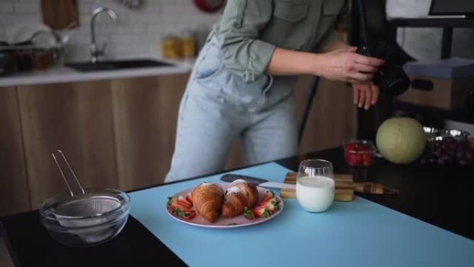 女美食摄影师为照片拍摄准备美味早餐