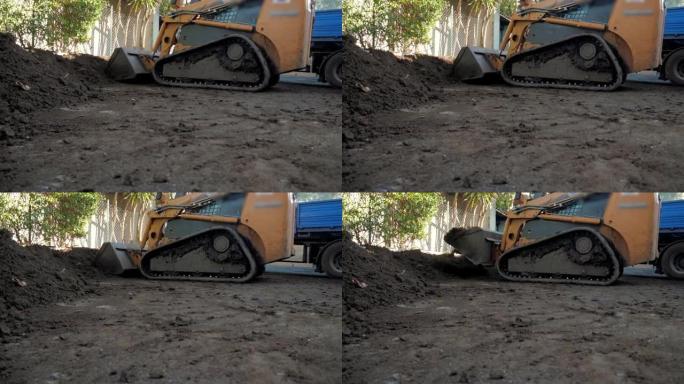 拖拉机装载机捡拾土壤的工作过程