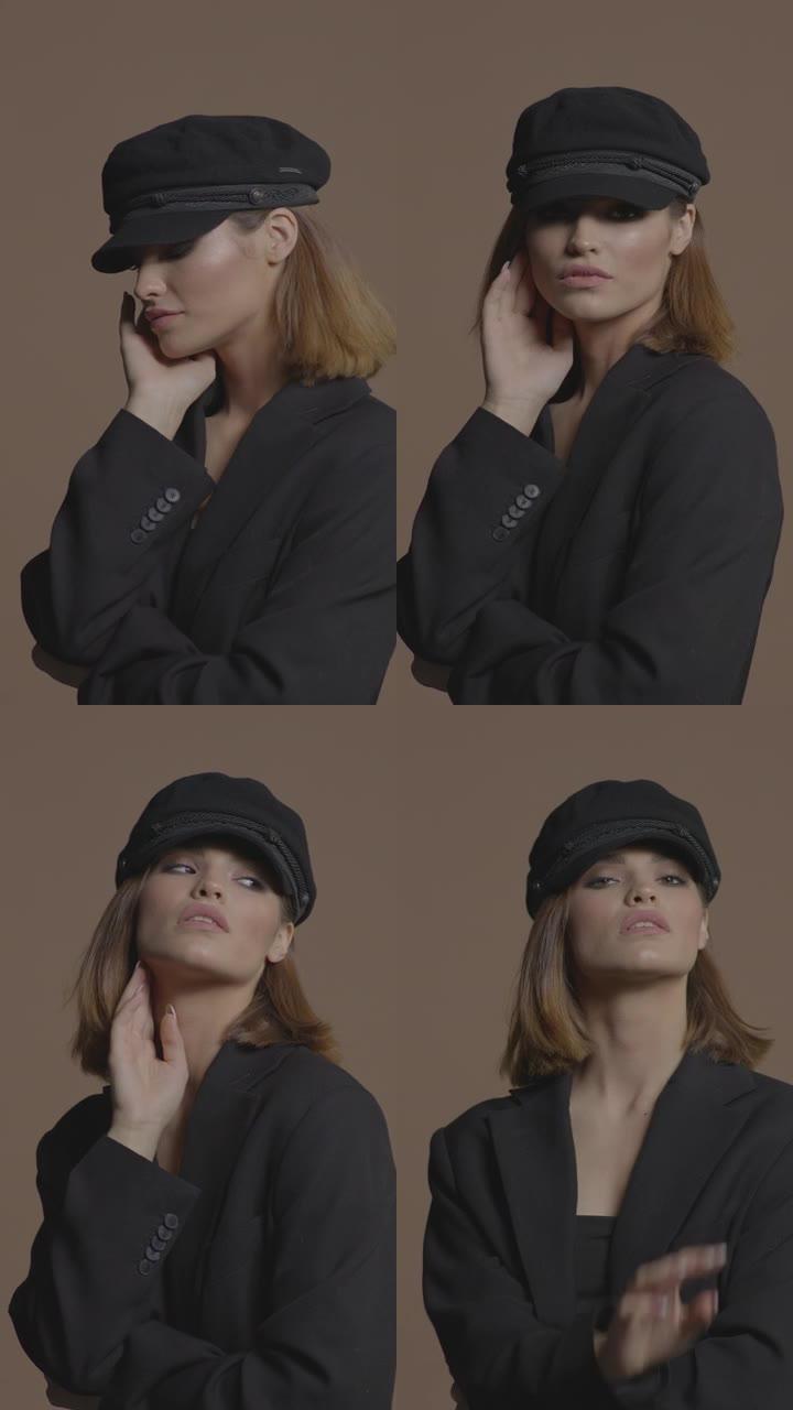 一个穿着黑色帽子和带有眼妆的夹克的短发的美丽女孩用手抚摸着她的脸。垂直格式视频。