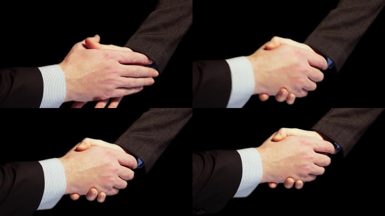 商人握手的特写。谈判成功后握手
