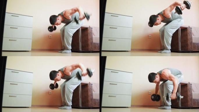 肌肉发达的运动员在家用哑铃靠在床上做运动。