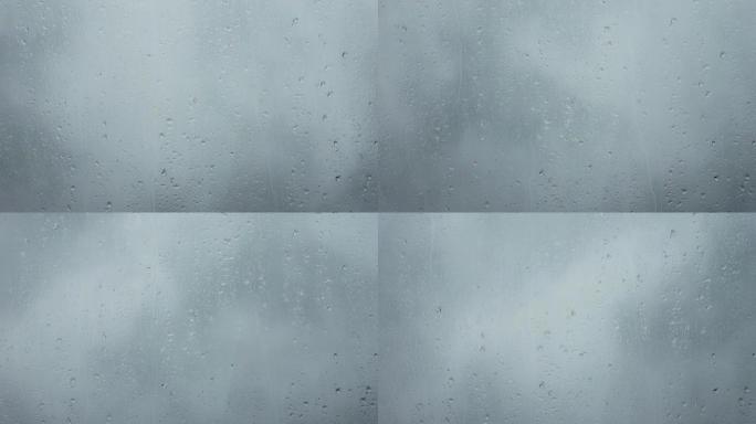 近距离观看时，雨滴从窗户流下。