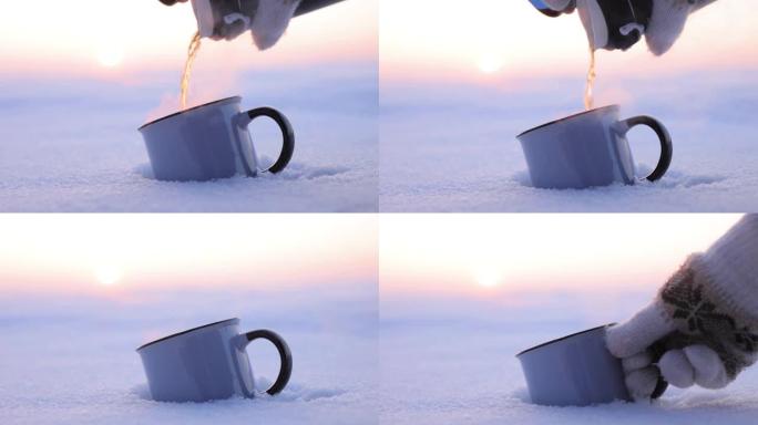 在寒冷的冬天，将热水瓶中的茶倒入杯子中