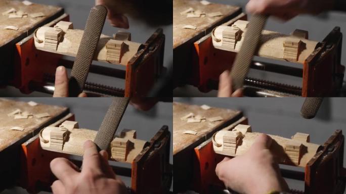 木雕师用锉刀从一块木头上清除多余的木头。木工艺术。手工制作的概念