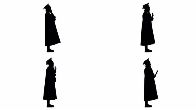 剪影情感女学生在毕业长袍上讲电话拿着文凭