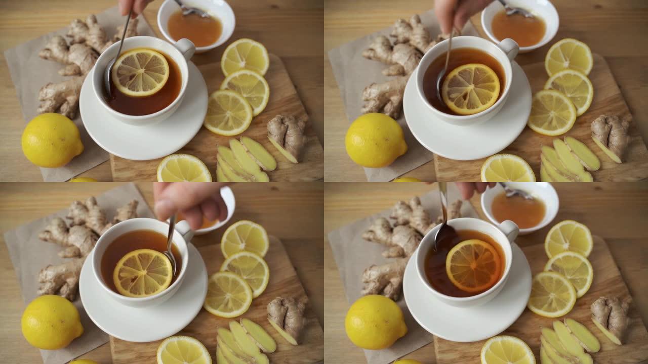 桌上的生姜，柠檬，蜂蜜，薄荷，茶壶和杯子