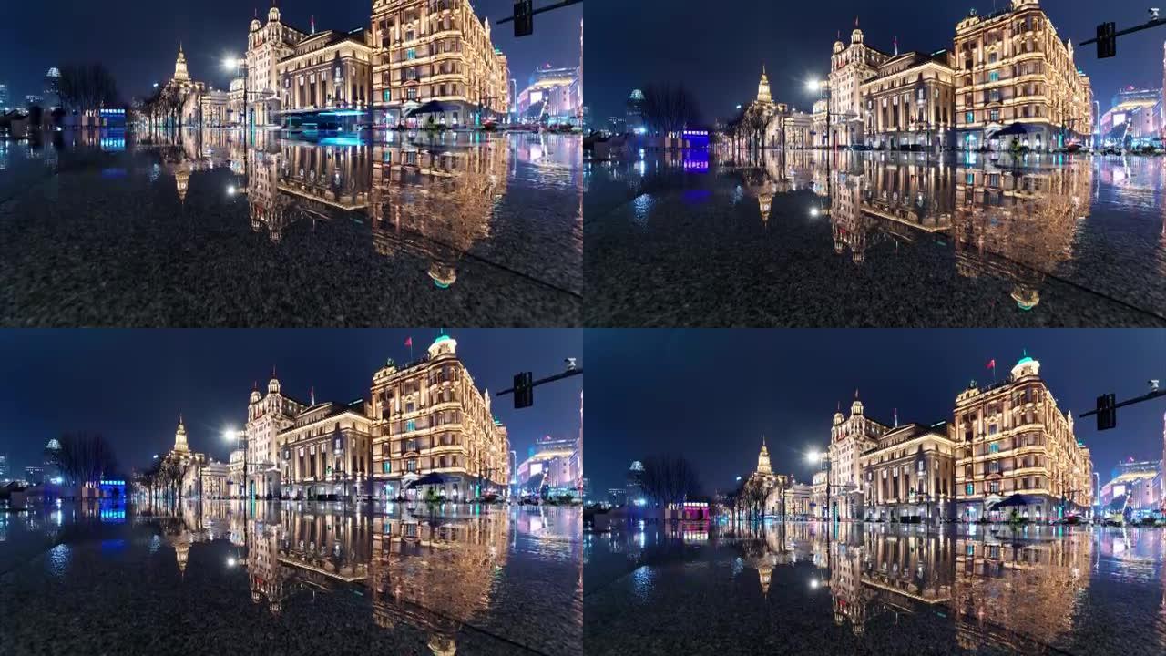 雨天上海外滩景观的4k倾斜延时镜头，夜间驾驶车灯完美反映历史建筑地标。