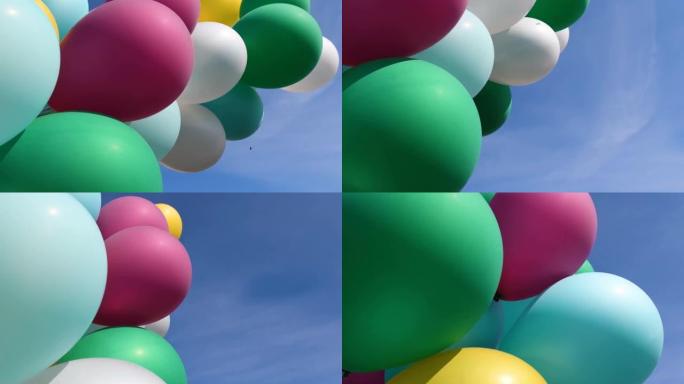 一堆多色气球。