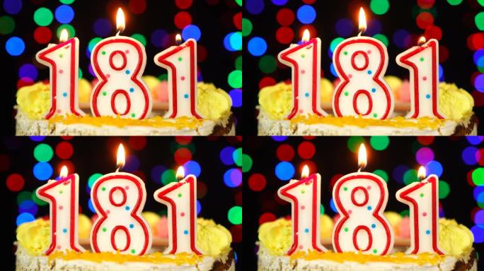 181号生日快乐蛋糕与燃烧的蜡烛顶。