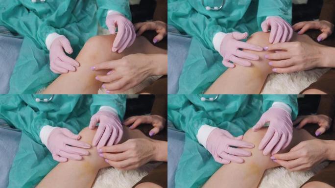 一名戴着医用手套的医生检查一名女性患者受伤的膝盖。