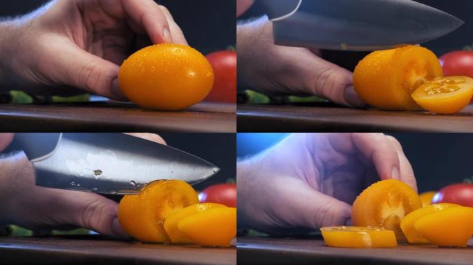 人手拿着黄色的番茄，用水滴和切口
