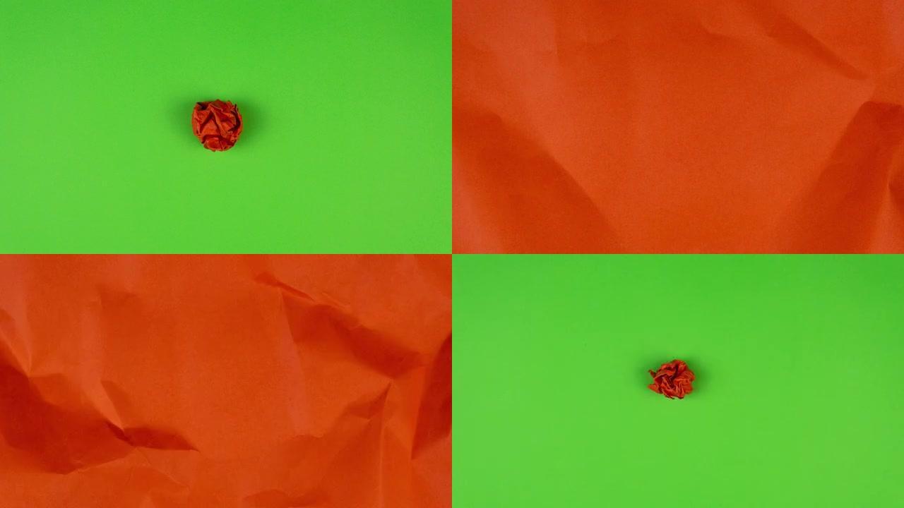 停止运动动画。红纸从纸球中展开，然后在绿色背景上起皱并消失