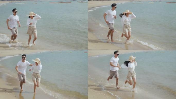 男女夫妇在海边玩耍，享受暑假，快乐地谈笑，看着海滩上的风景。