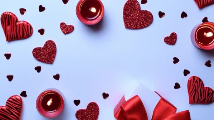 情人节礼品盒，红色爱心，白色背景上的浪漫蜡烛。带有复制空间的浪漫消息模板。顶视图。从上方观看。