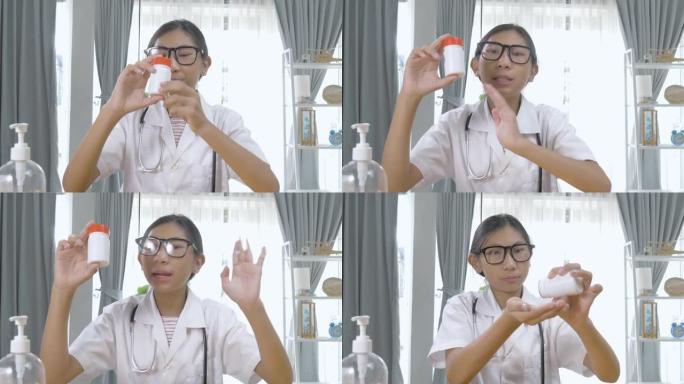 亚洲药剂师女孩在家通过视频通话解释药瓶，锁定生活方式概念。